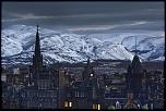 Poza zilei-old-town-spires-snow-capped-hills-jpg