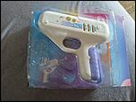 Pistol cu bomboana pe bat surpriza-l1-jpg